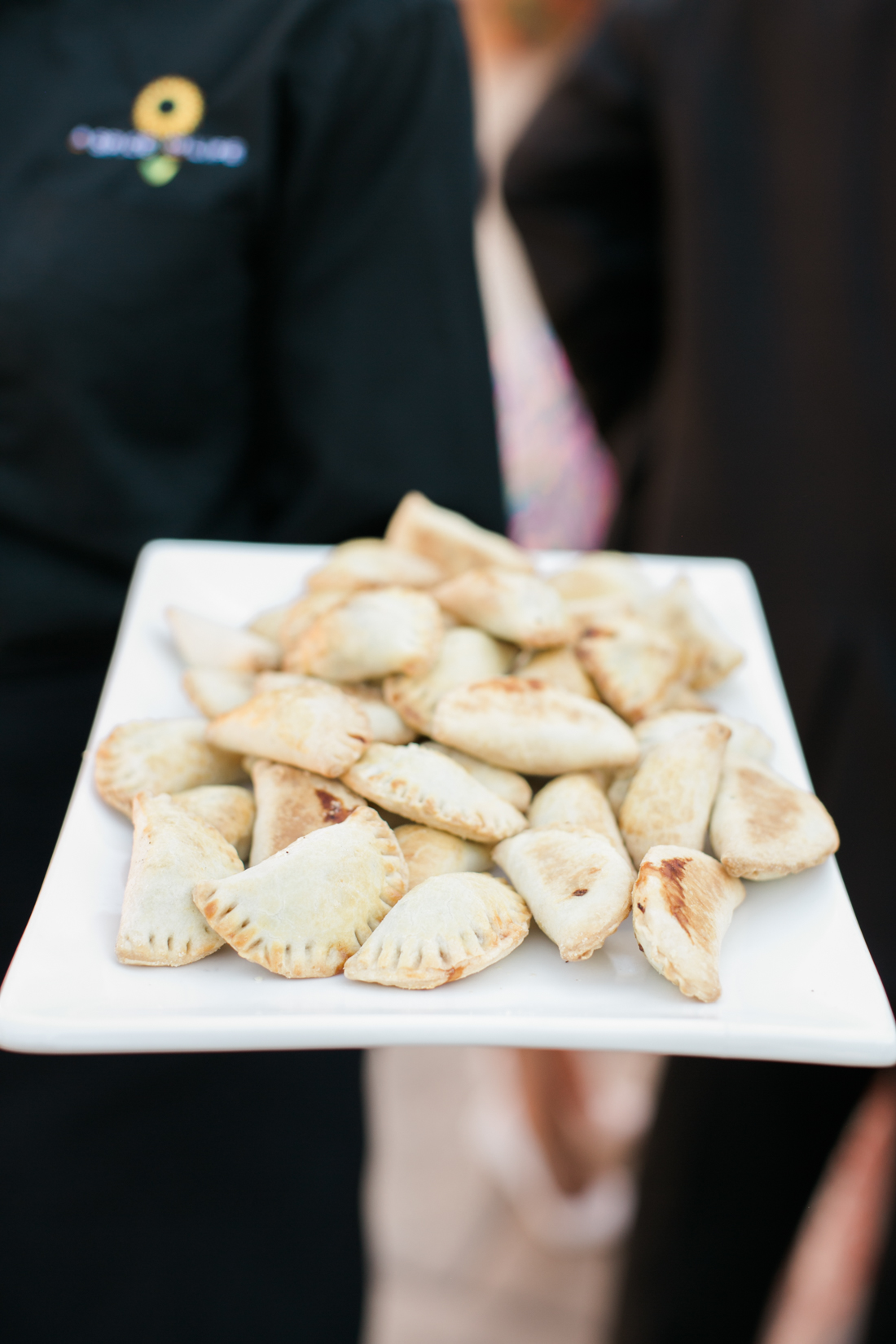 Server holding appetizers on a tray